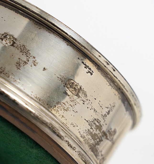 A George VI silver shell dish, Sheffield, 1946, 14.2cm, a modern silver mounted wine coaster and a late Victorian silver five bar toast rack. Condition - fair